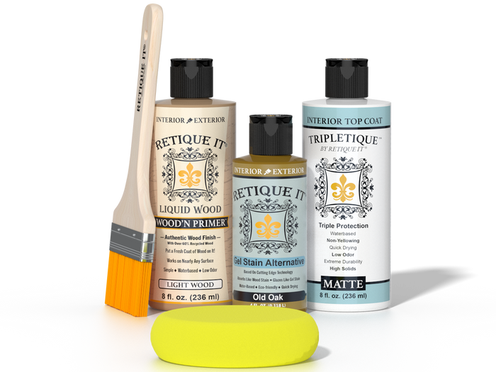 Retique It® Light Wood Wood’n Primer with Old Oak Gel Stain Alternative, matte topcoat, brush, and yellow sponge on a tabletop.