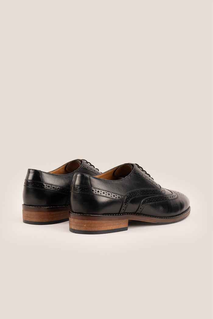 Experience comfort and style with the Winston Black Wide Fit brogue. Premium leather, classic brogue detailing, and extra room for all-day wear.
