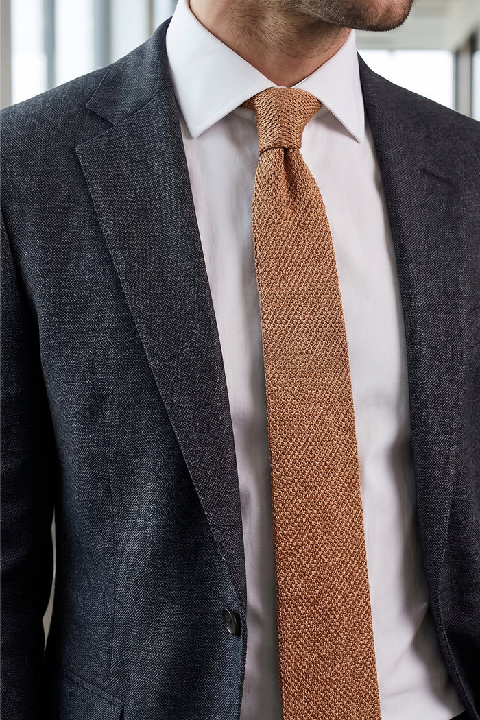 Ash Beige knitted tie with hand finishing, perfect for weddings and formal occasions.