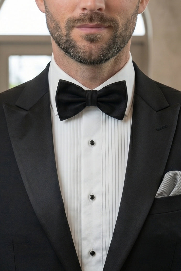 Man wearing Black Silk Bow Tie with luxurious design, perfect for weddings and formal events.