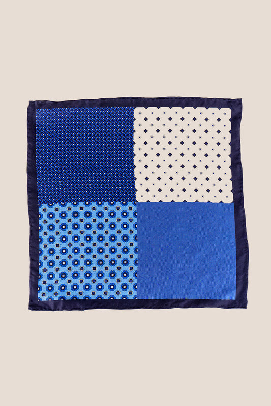 Blue silk pocket square handkerchief with four versatile folds, perfect for weddings, business attire, or refined casual wear.