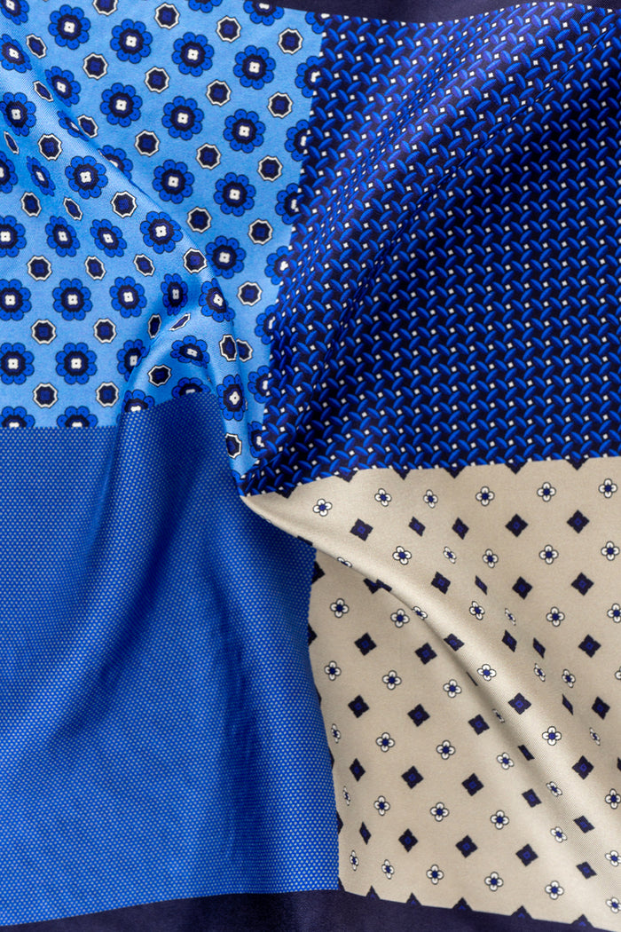 Blue silk pocket square handkerchief with four versatile folds, perfect for weddings, business attire, or refined casual wear.