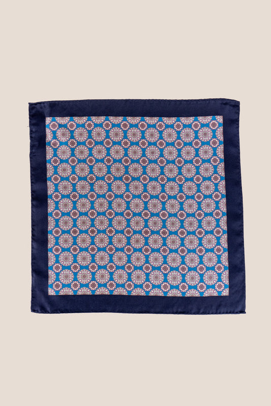 Men’s blue silk handkerchief with an intricate geometric pattern, perfect for weddings, formal occasions, or sophisticated smart dressing.