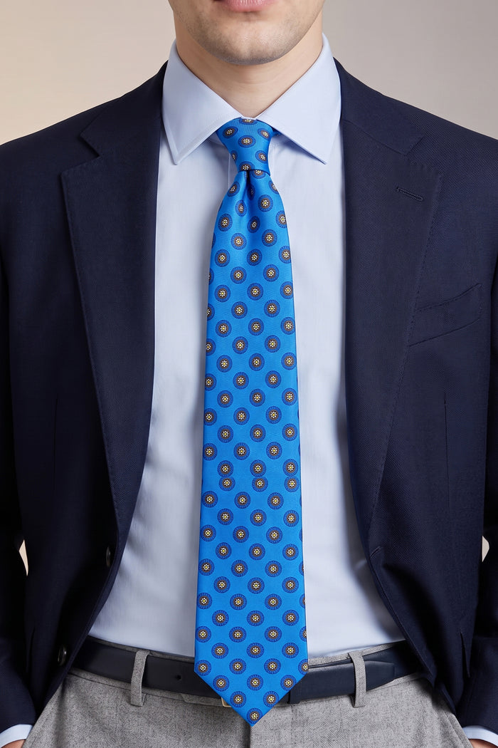 Man wearing Blue Geometric Pattern Silk Tie with striking design, ideal for weddings, formal events, and smart attire.