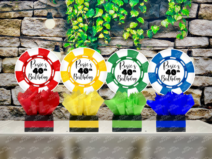 Set of four casino poker chip table centerpieces in red, yellow, green, and blue, personalized for your next event with matching tissue paper and base trim