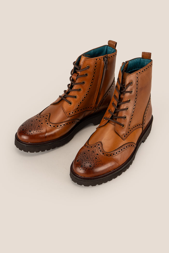 Graham tan leather brogue boots for men with classic perforated detailing, ideal for dressy and smart-casual occasions.