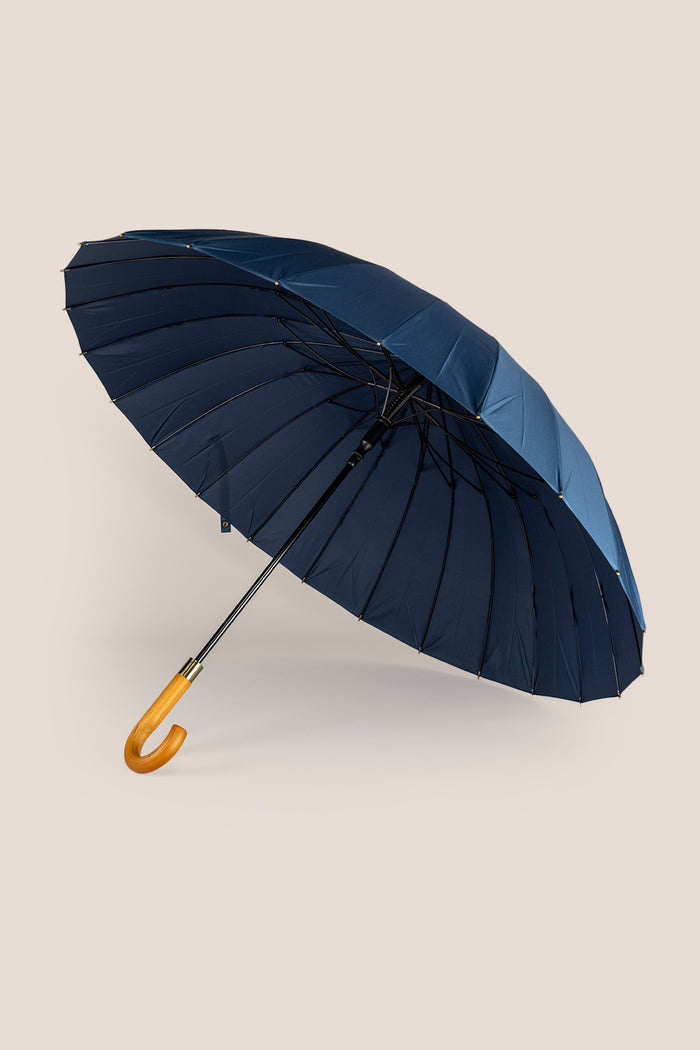 Joseph Blue men’s windproof umbrella with wooden J-handle, blending classic design with reliable durability for refined all-weather protection.
