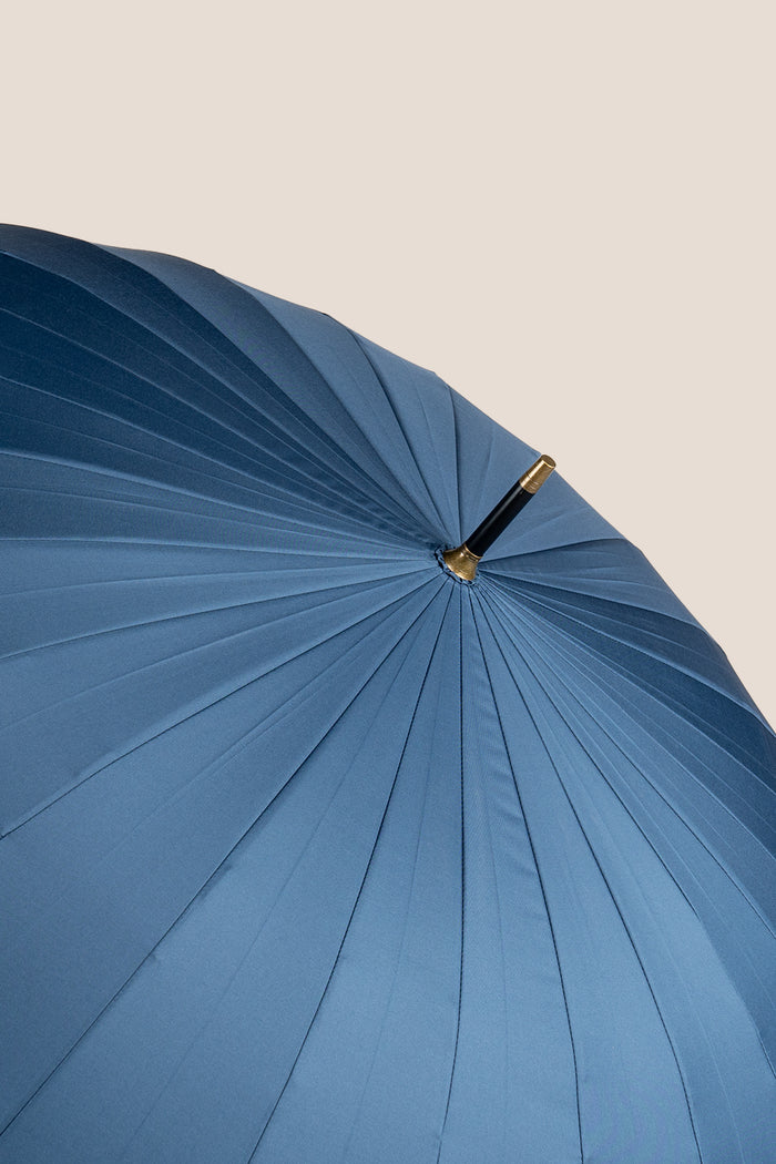 Joseph Blue men’s windproof umbrella with wooden J-handle, blending classic design with reliable durability for refined all-weather protection.