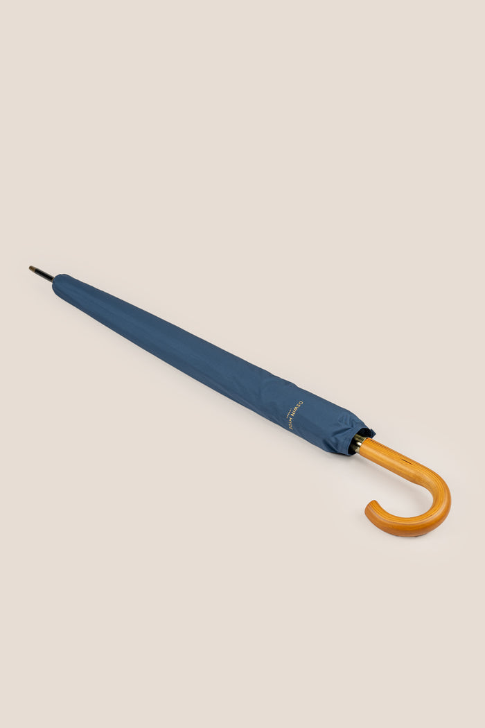 Joseph Blue men’s windproof umbrella with wooden J-handle, blending classic design with reliable durability for refined all-weather protection.