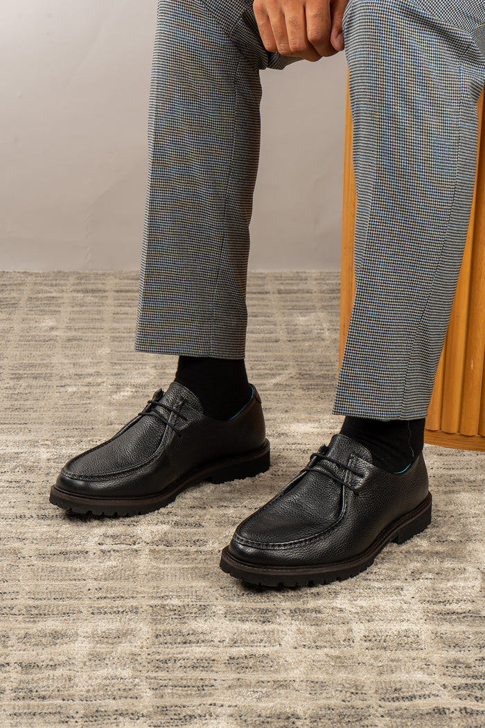 Joshua black leather Wallabee shoes for men by Oswin Hyde – casual luxury footwear with moccasin-style stitching and premium comfort.