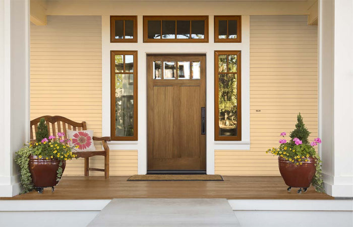 Retique It Wood'n Finish Kits exterior top coat in barn wood gloss, shown on a front door with smooth, glossy wood finish.