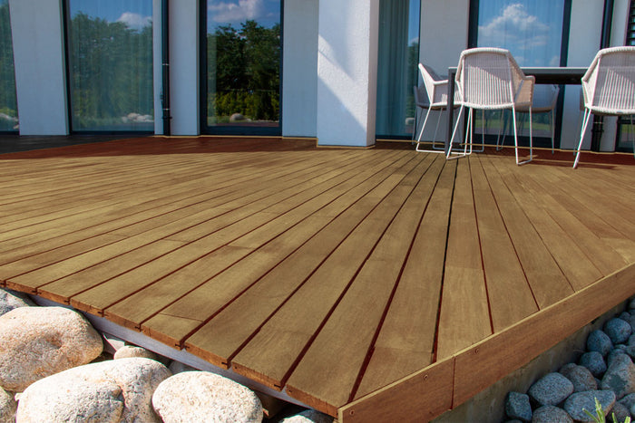 Retique It Wood'n Finish Kit in Barn Wood with matte exterior top coat applied to decking for a smooth, durable finish.
