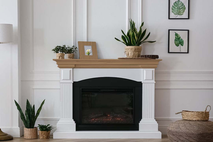 Retique It Multi-purpose Smooth Finish Kit in Barn Wood for interior wood projects, showing a fireplace mantle with a smooth wood finish.