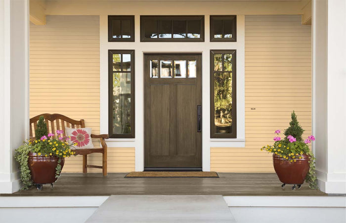 Retique It wood finish kit with black walnut exterior top coat, featuring a smooth finish on a wooden door.