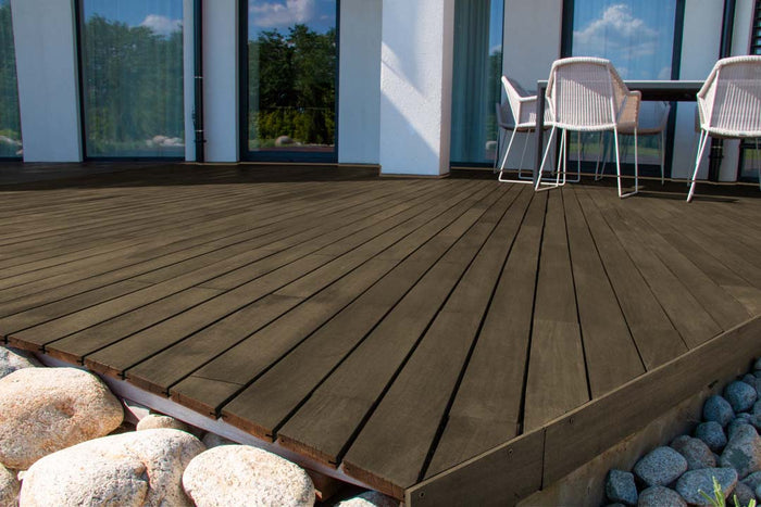Retique It Multi-purpose Smooth Finish Kit in Black Walnut for exterior wood, showing a deck with a smooth, finished surface.