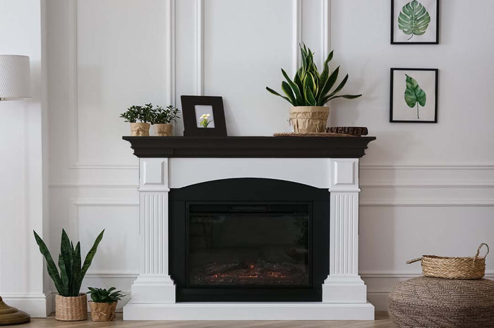 Retique It wood finish kit featuring a smooth black interior top coat on a fireplace mantle for a sleek, refined look.