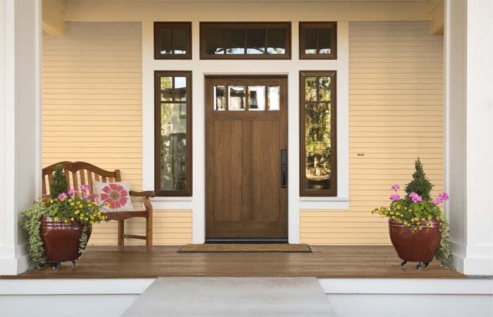 Retique It wood finish kit with dark oak exterior gloss top coat applied to a front door, showcasing smooth, glossy wood surface.
