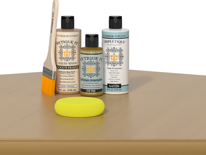 Retique It® Light Wood Wood’n Primer with Old Oak Gel Stain Alternative, satin topcoat, brush, and yellow sponge on a tabletop.