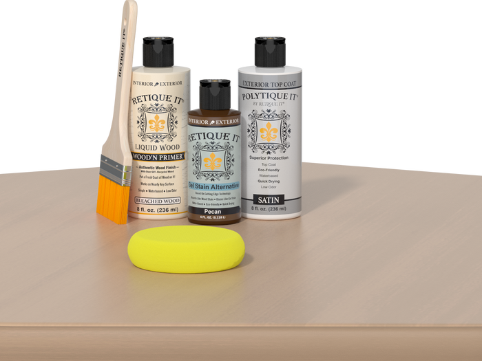 Retique It® White Oak kit with brush, Wood’n Primer, Pecan stain alternative, satin top coat, and yellow sponge on a wood surface.