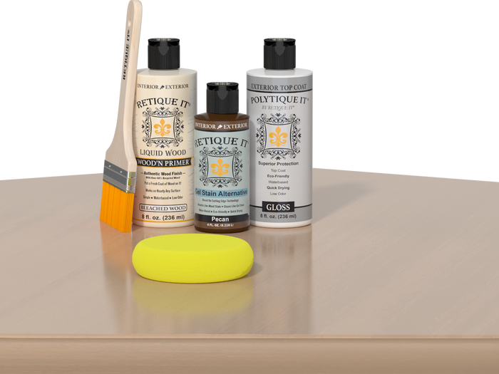 Retique It® White Oak kit with brush, Wood’n Primer, Pecan stain alternative, gloss top coat, and yellow sponge on a wood surface.