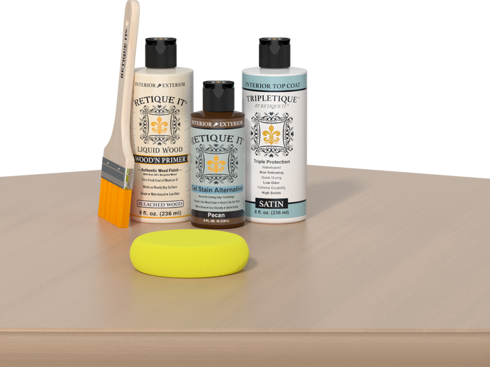 Retique It® White Oak kit with brush, Wood’n Primer, Pecan stain alternative, satin top coat, and yellow sponge on a wood surface.