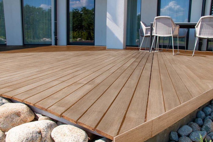 Retique It Multi-purpose Smooth Finish Kit (4x Lg) in Pecan for wood finishing, shown on decking with smooth, even surface.