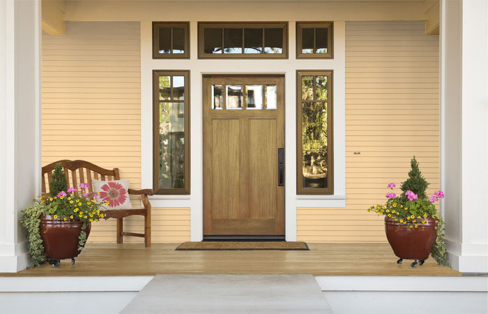 Retique It Multi-purpose Smooth Finish Kit in Barn Wood for exterior top coat, featuring a matte wood finish on a front door.