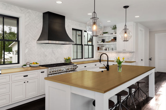 Retique It Multi-purpose Smooth Finish Kit in Barn Wood for interior wood surfaces, featuring gloss top coat on a kitchen countertop.