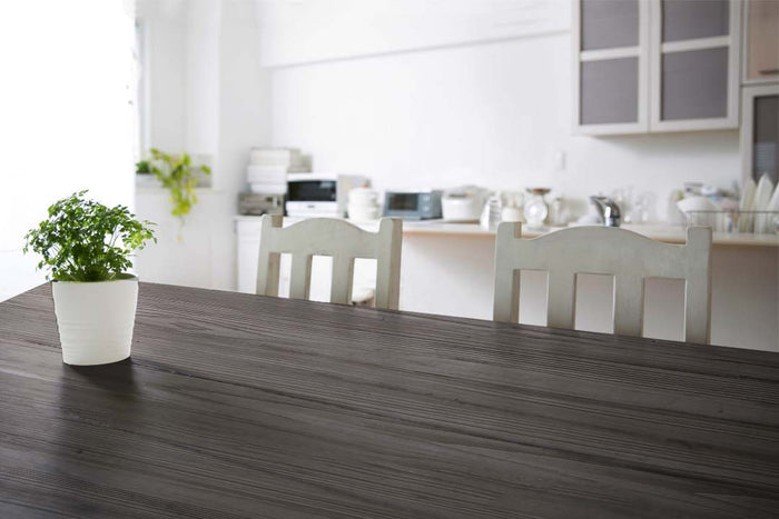 Retique It Wood'n Kit Harbor Gray interior top coat applied to a wooden tabletop with a textured grain finish.