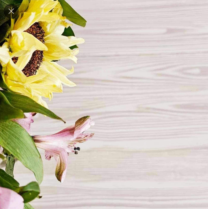 Retique It Wood'n Finish Kit with a flowersonsbtable showing wood finish and detailed application process on a furniture surface.