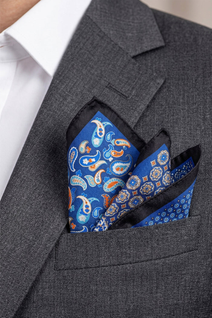 Men’s navy silk pocket square handkerchief with four versatile folds and intricate pattern, ideal for weddings, formal occasions, or smart casual wear.