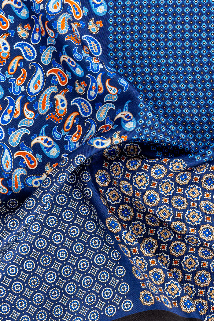 Men’s navy silk pocket square handkerchief with four versatile folds and intricate pattern, ideal for weddings, formal occasions, or smart casual wear.