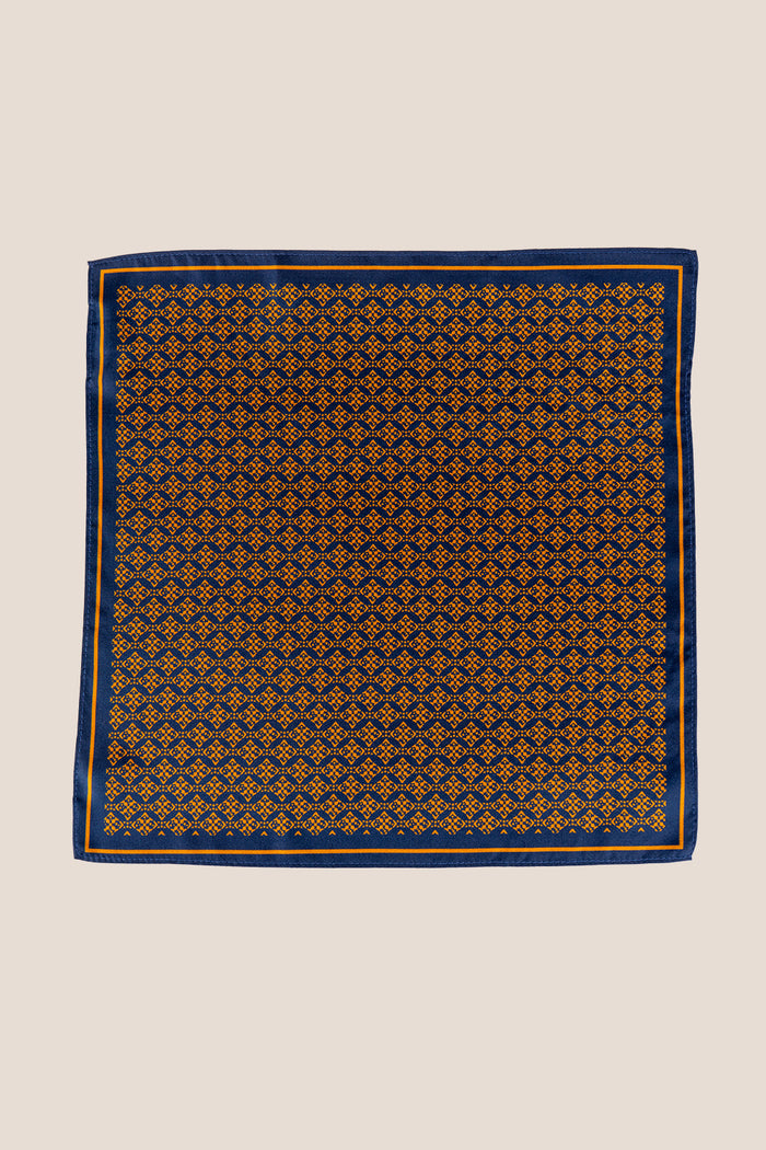 Men’s orange silk handkerchief with an intricate geometric pattern, crafted for weddings, formal occasions, or stylish smart dressing.
