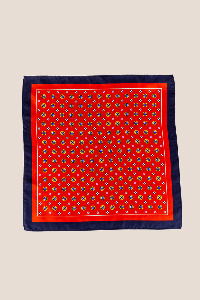 Men’s red silk pocket square with an intricate geometric pattern, crafted for weddings, formal occasions, or sophisticated smart attire.