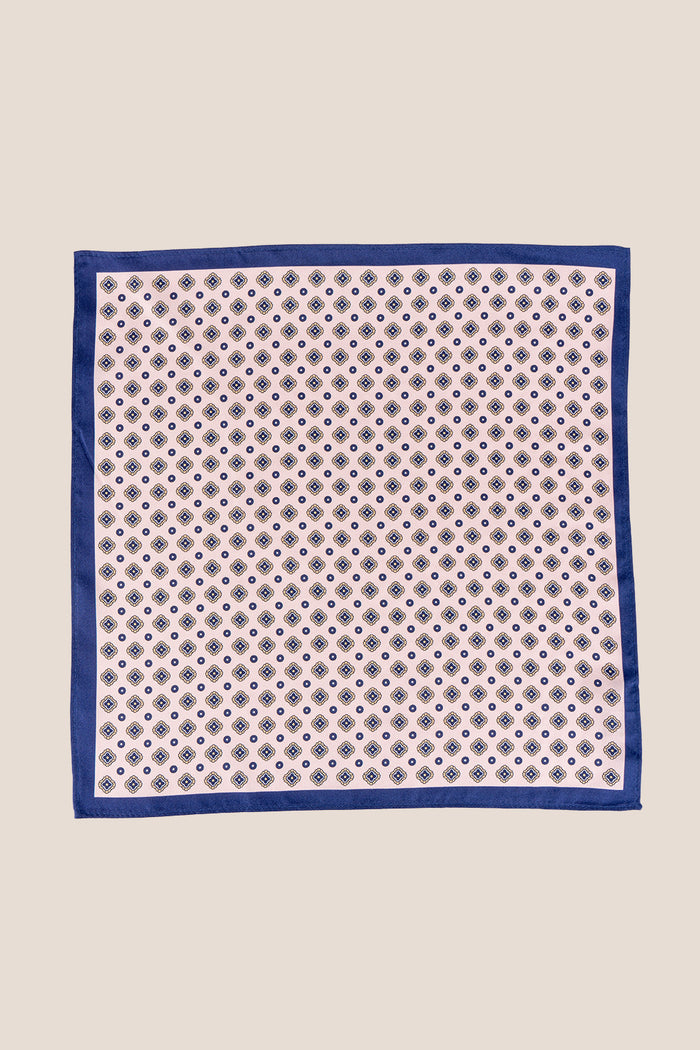 Salmon silk pocket square for men with intricate geometric pattern, crafted from luxurious silk for formal and smart-casual occasions.
