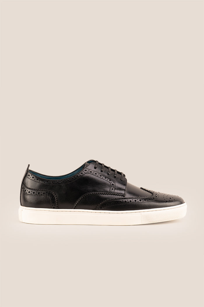 Stan Black wingtip brogue trainer shoes for men, crafted from premium leather with classic wingtip detailing and modern trainer sole.