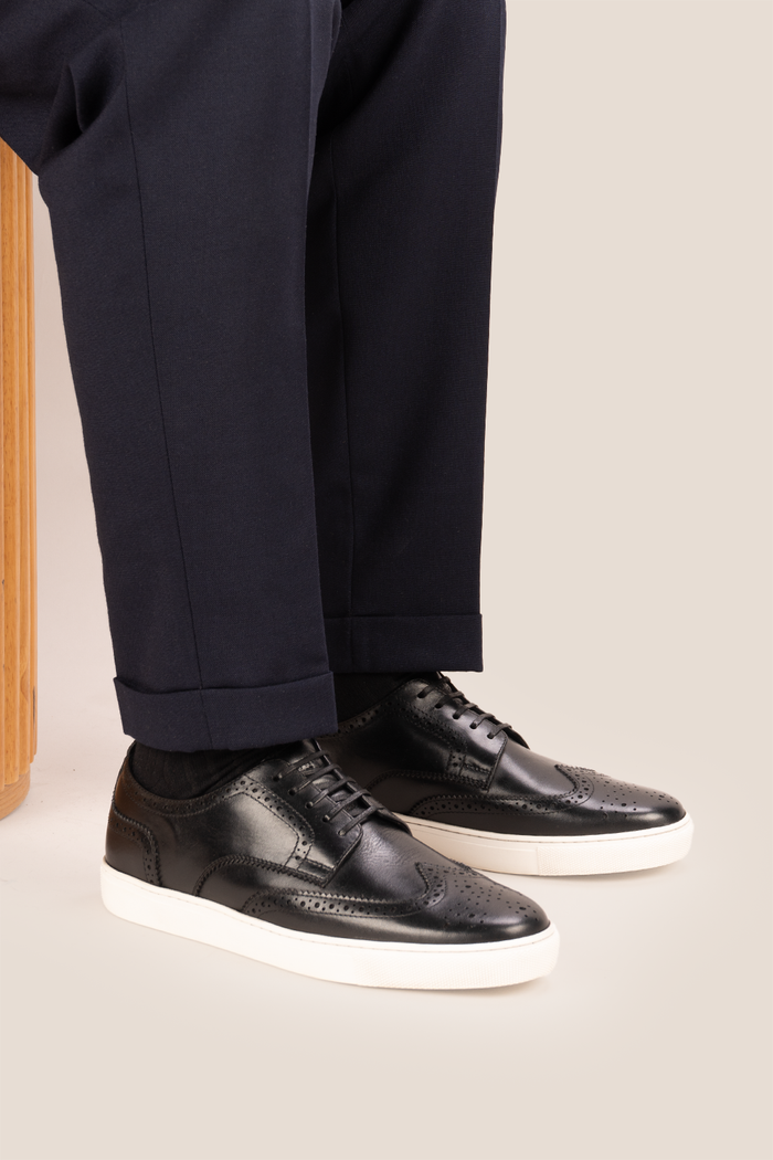Stan Black wingtip brogue trainer shoes for men, crafted from premium leather with classic wingtip detailing and modern trainer sole.