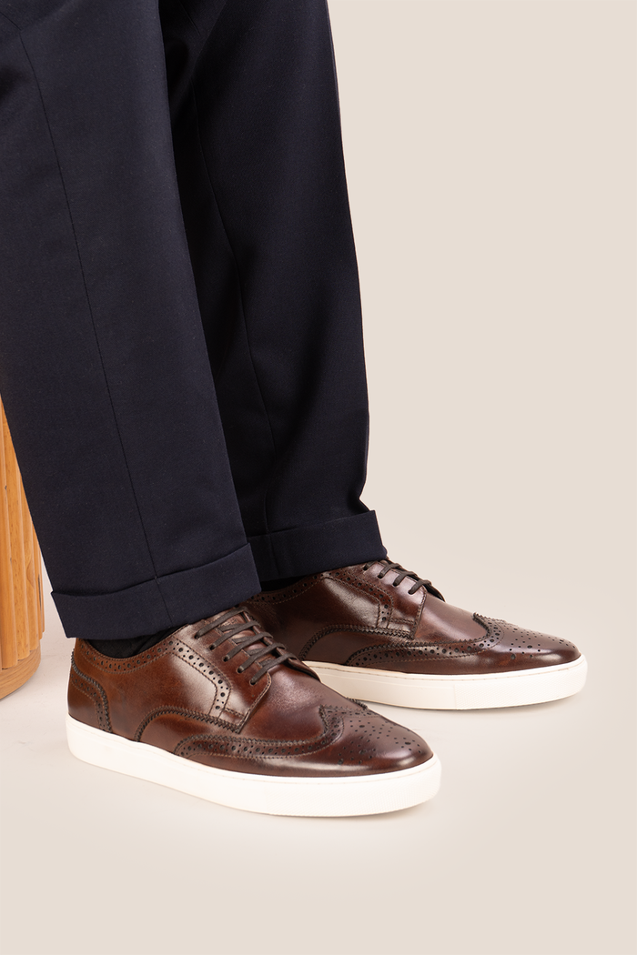 Stan Brown wingtip brogue trainer shoes for men, crafted from premium leather with classic wingtip detailing and modern trainer sole.