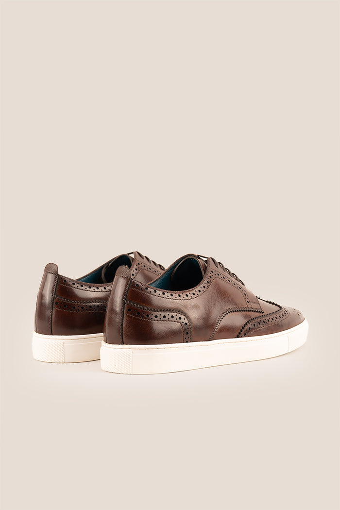 Stan Brown wingtip brogue trainer shoes for men, crafted from premium leather with classic wingtip detailing and modern trainer sole.