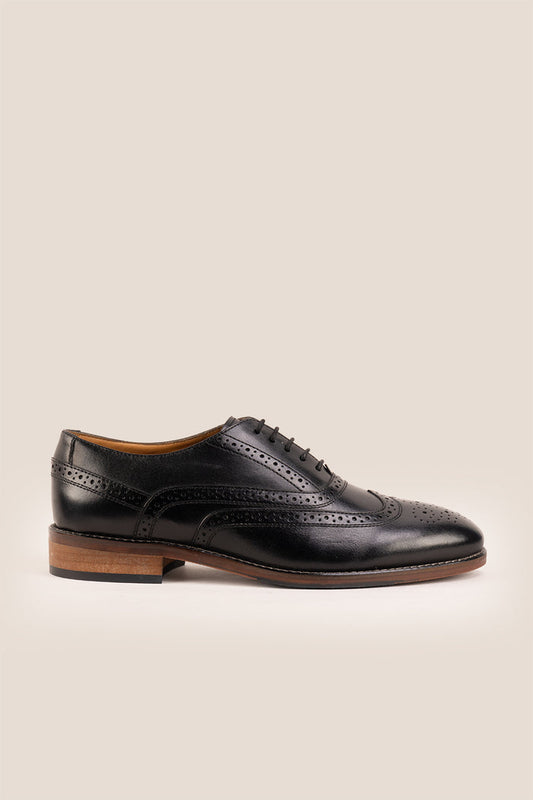 Experience comfort and style with the Winston Black Wide Fit brogue. Premium leather, classic brogue detailing, and extra room for all-day wear.