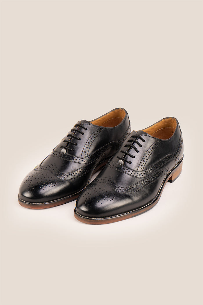 Experience comfort and style with the Winston Black Wide Fit brogue. Premium leather, classic brogue detailing, and extra room for all-day wear.
