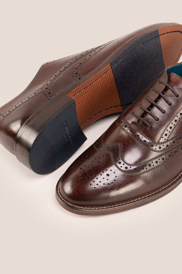 Experience comfort and style with the Winston Brown Wide Fit brogue. Premium leather, classic brogue detailing, and extra room for all-day wear.
