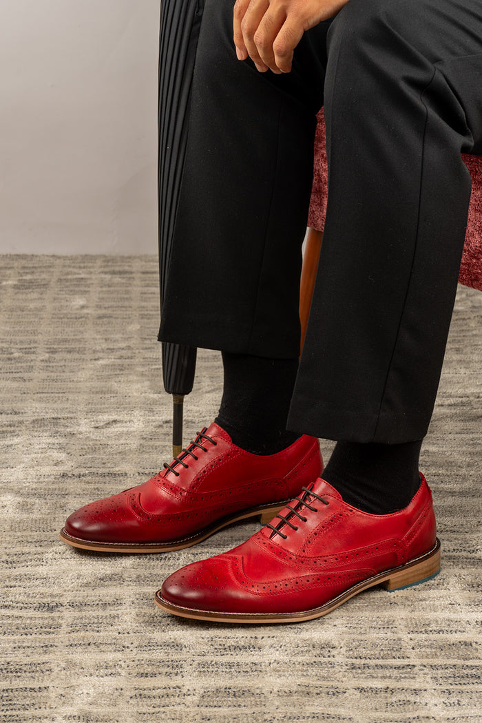 Winston cherry leather Oxford brogues for men featuring wingtip perforations and polished finish, ideal for formal and smart-casual occasions.