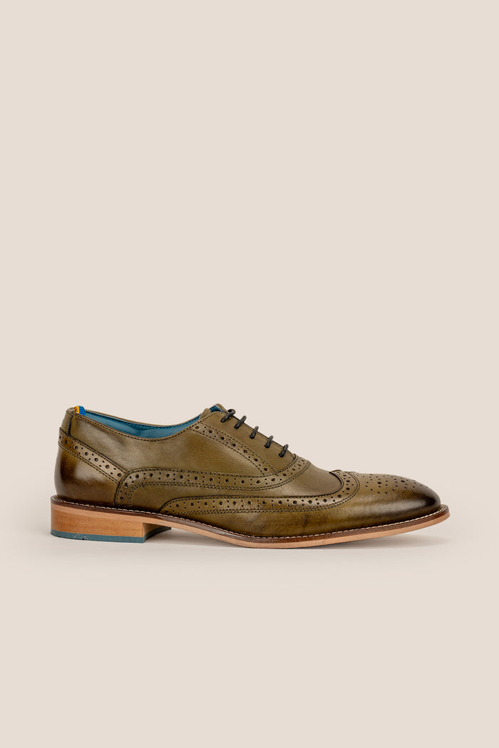 Winston men’s Oxford brogue shoes in green leather with wingtip detail, perforated accents, and a classic lace-up silhouette—crafted for formal distinction.