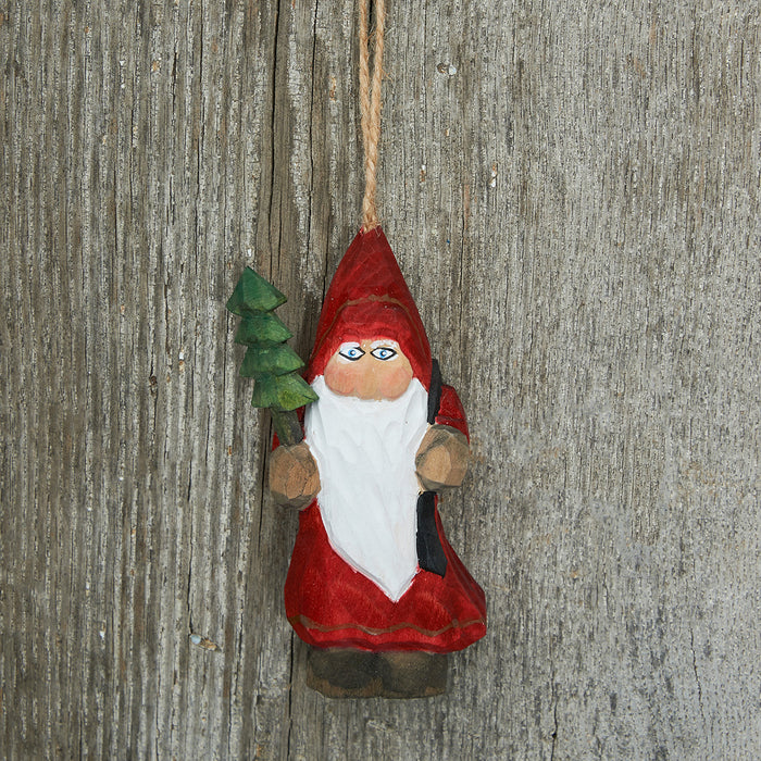 A Wood Carved Santa Ornament.