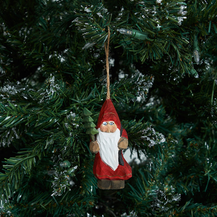 A Wood Carved Santa Ornament.